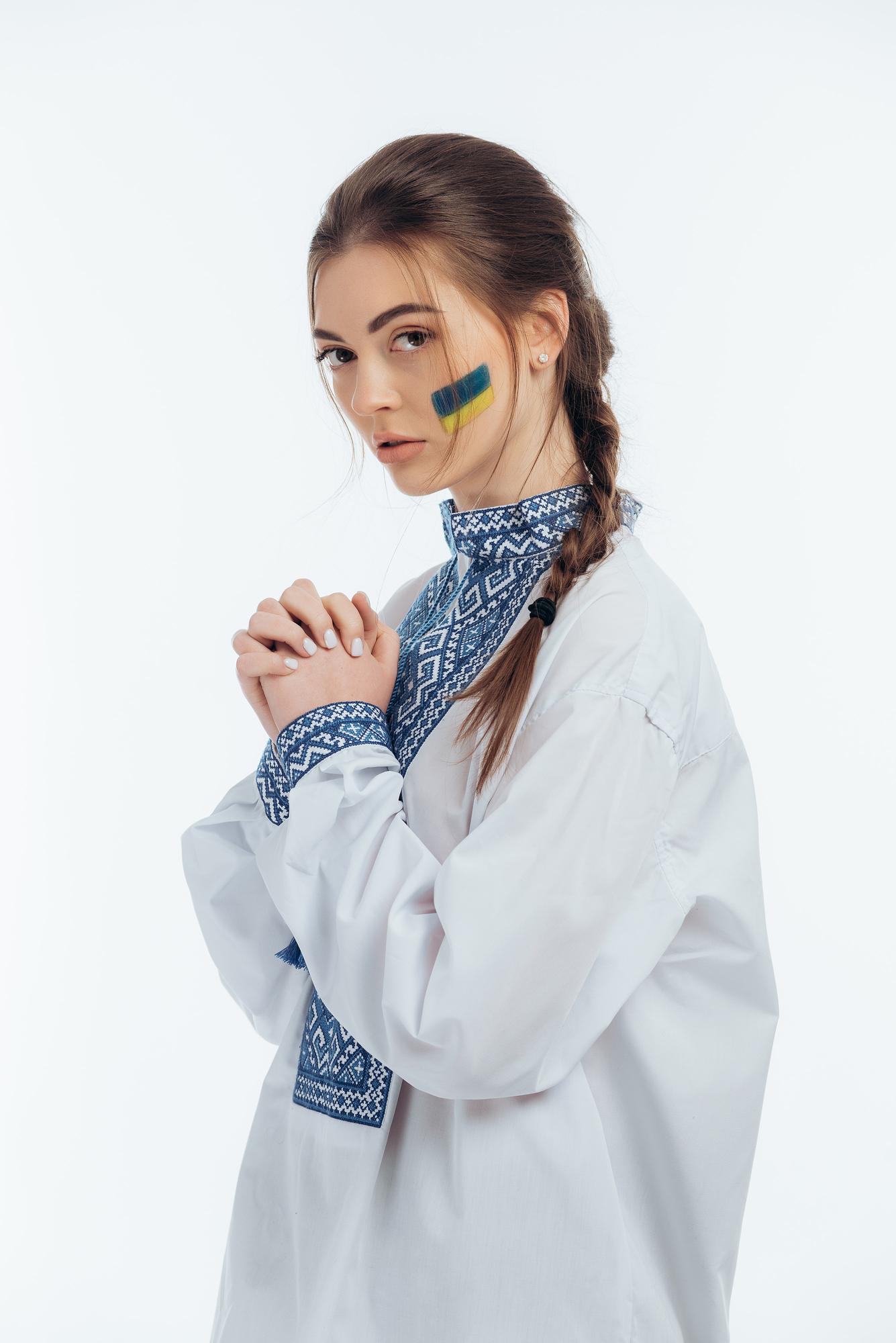 large editorial shot of embroidered garment on model
