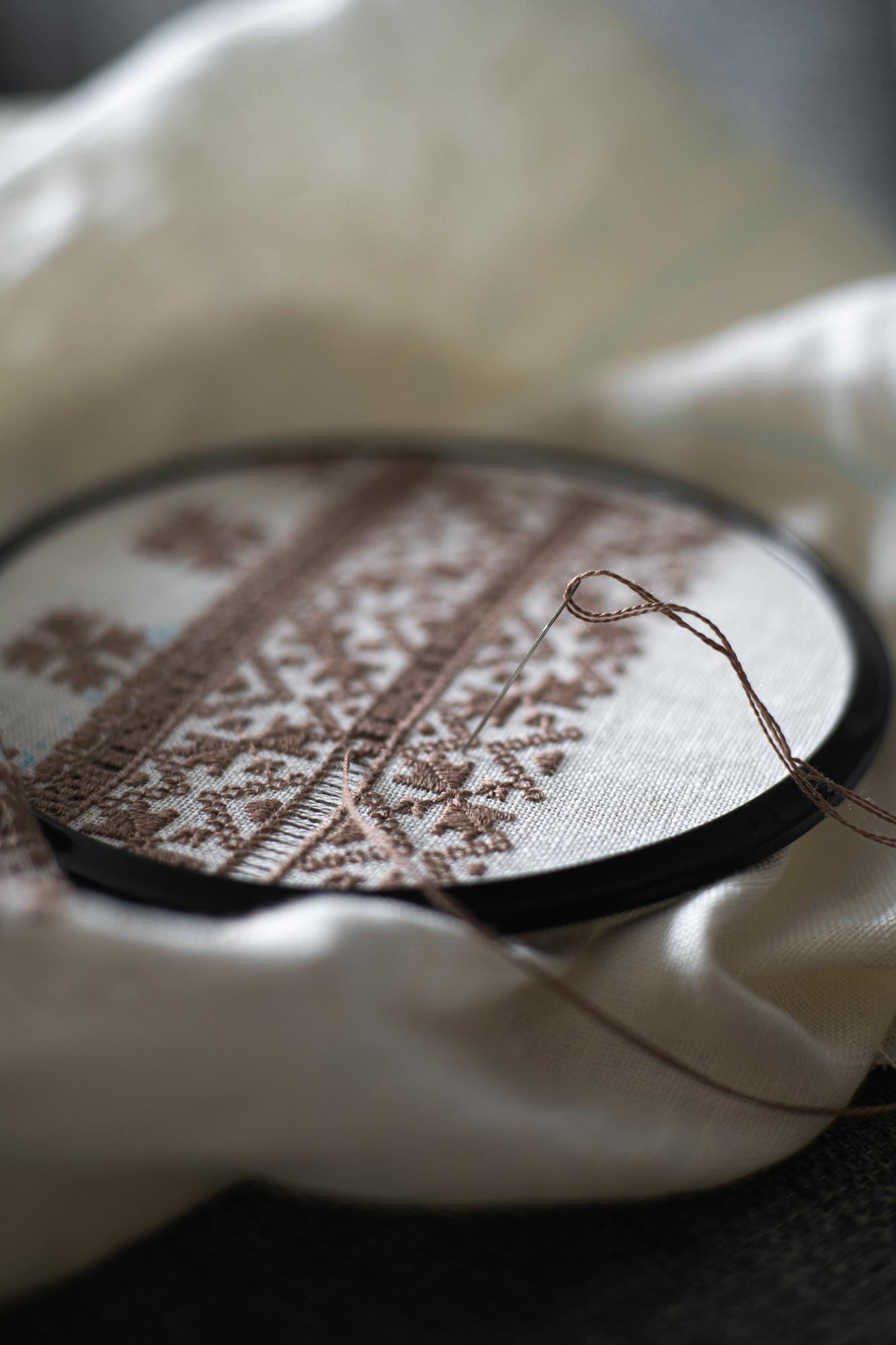 close-up of hand-guided embroidery on linen